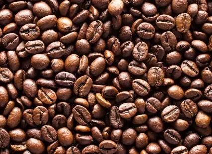 Roasted coffee beans representing caffeine anhydrous